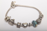 Pandora armband- Sterlingsilver, Med berlocker
