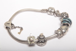 Pandora armband- Sterlingsilver, Med berlocker